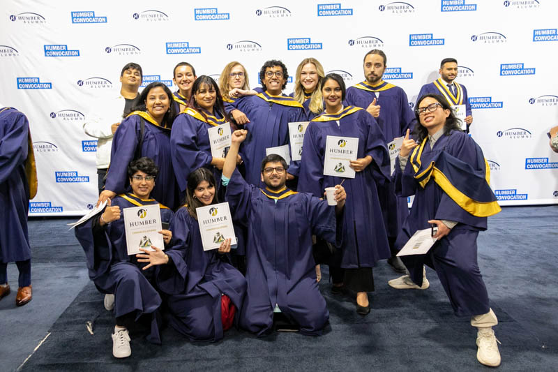 Group of graduates smiling for photo