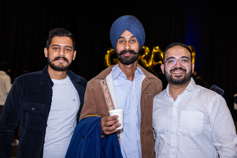 Three people posing for photo