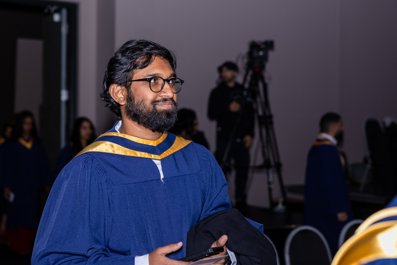 Student smiling in line