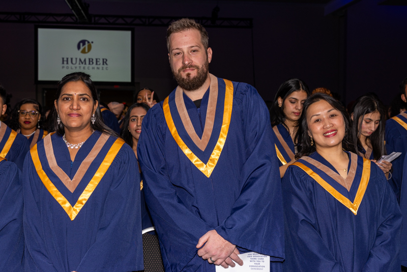 Students posing in their gowns