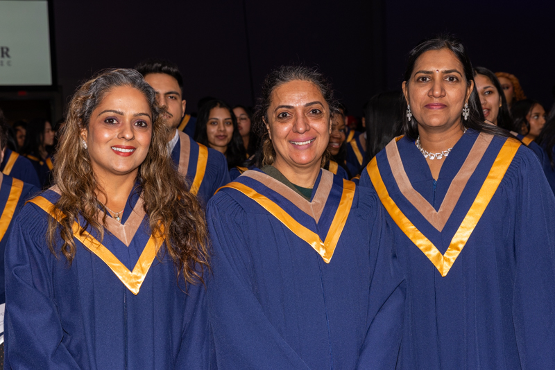 Students posing in their gowns