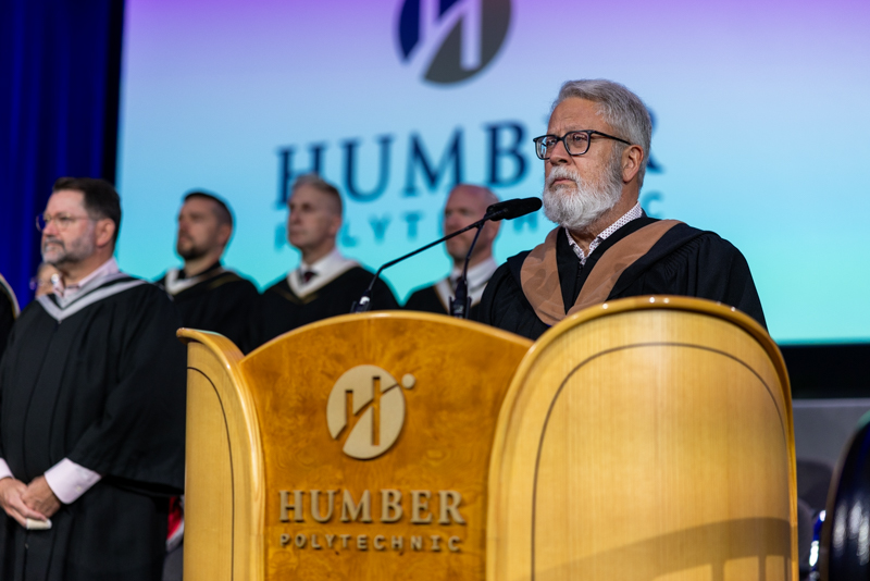 Humber staff talking on podium