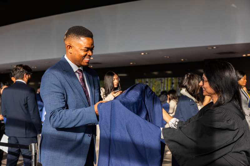 Student receiving their gown