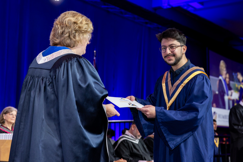 Student receiving diploma