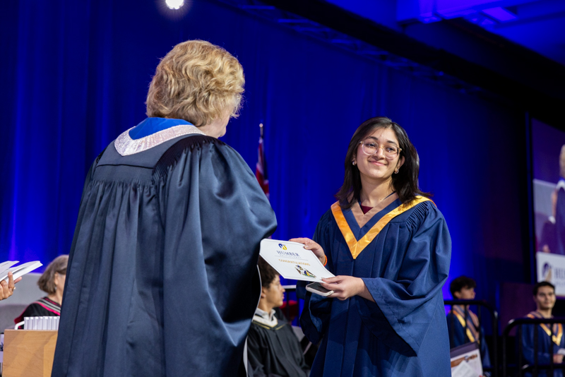 Student receiving diploma