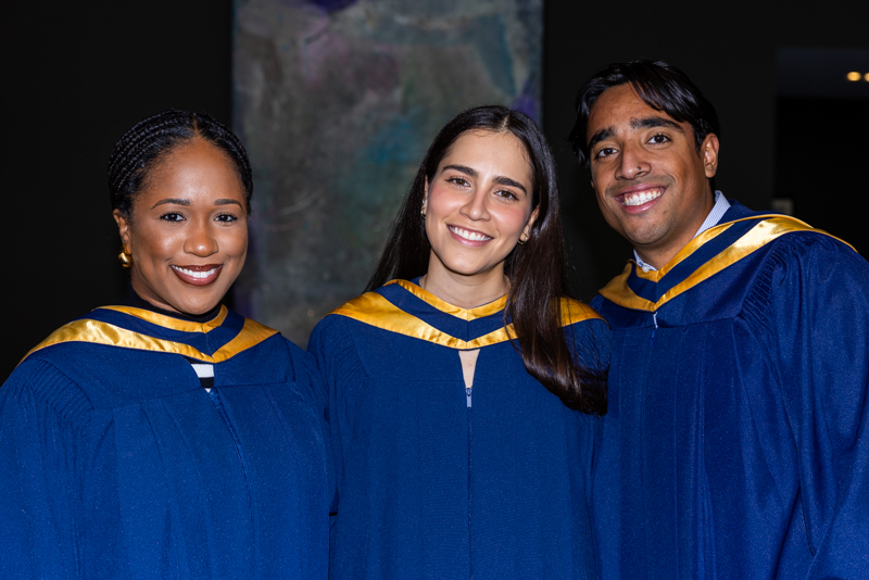 Students posing in gown