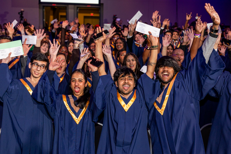 All students raising their arms