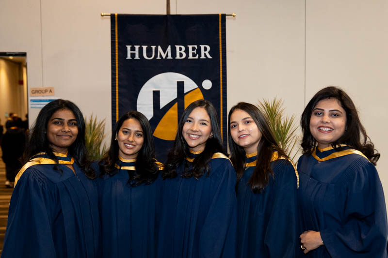 Students in front of Humber Flag
