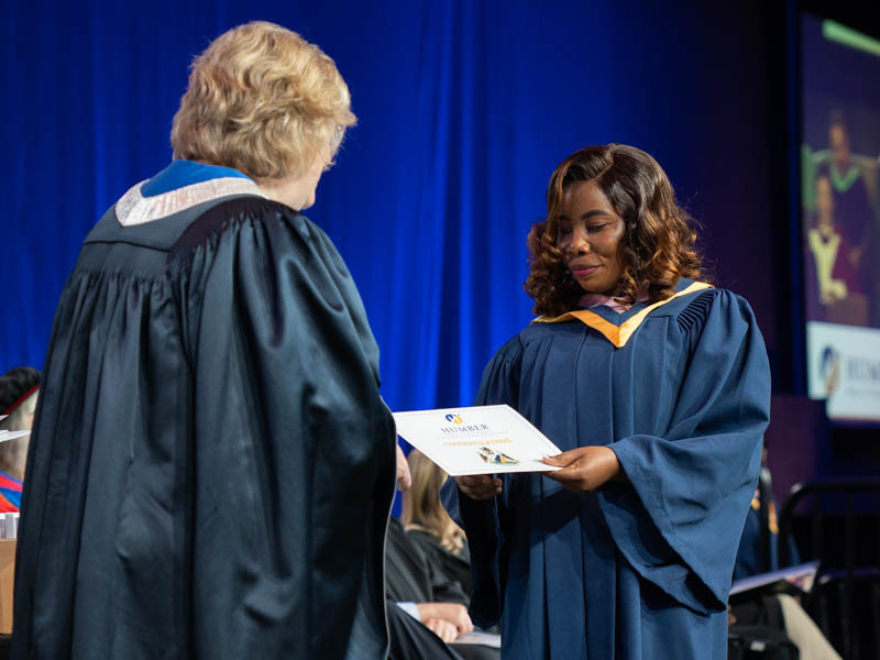 Student receiving diploma