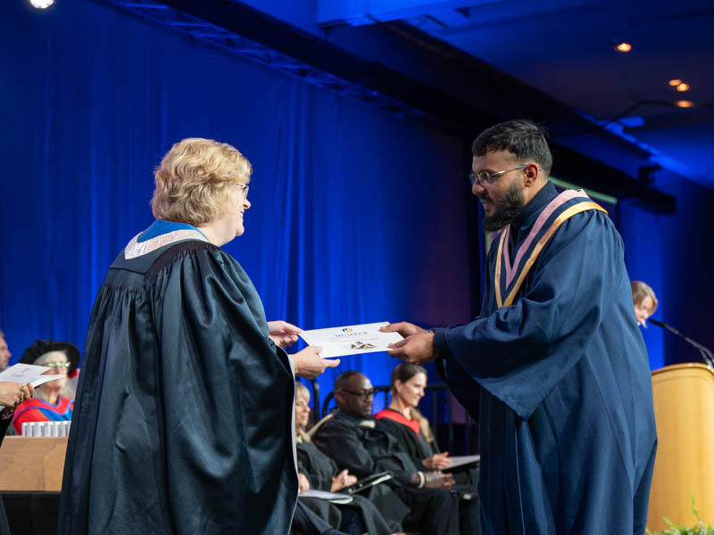 Student receiving diploma