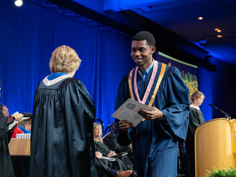 Student receiving diploma