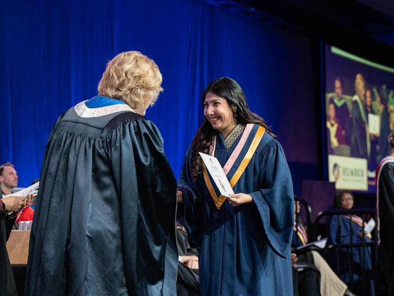 Student receiving diploma
