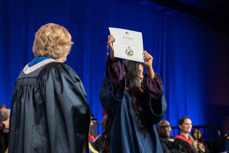 Student holding diploma
