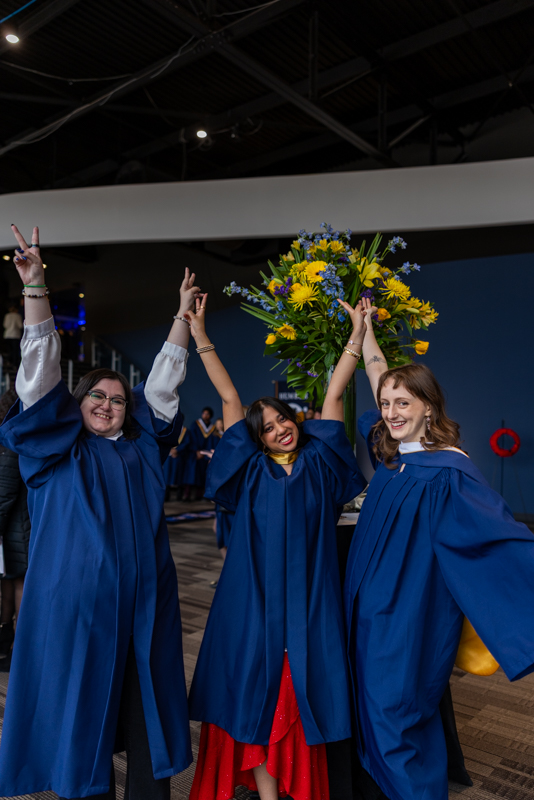 Students with their hands in the air