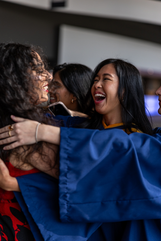 Students hugging and laughing