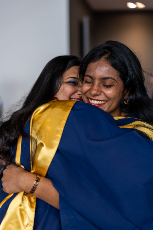 Students hugging and laughing