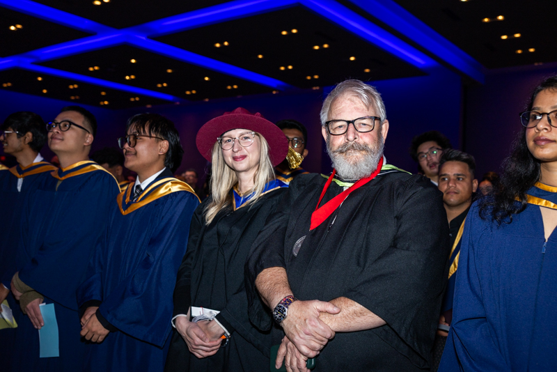 Students and Staff watching ceremony