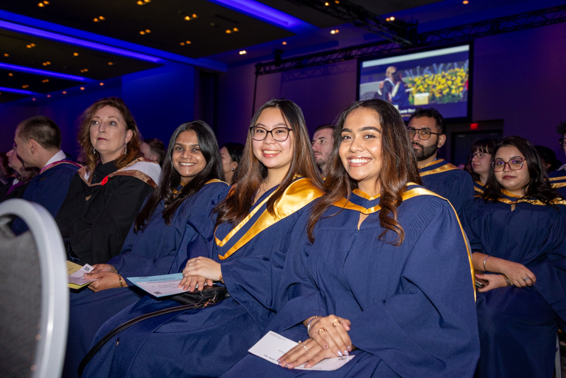 Students smiling sitting down