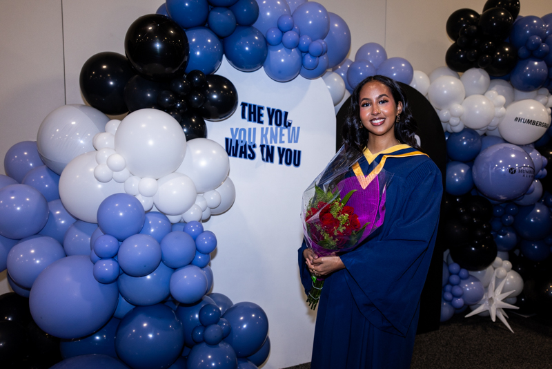 Student holding flowers