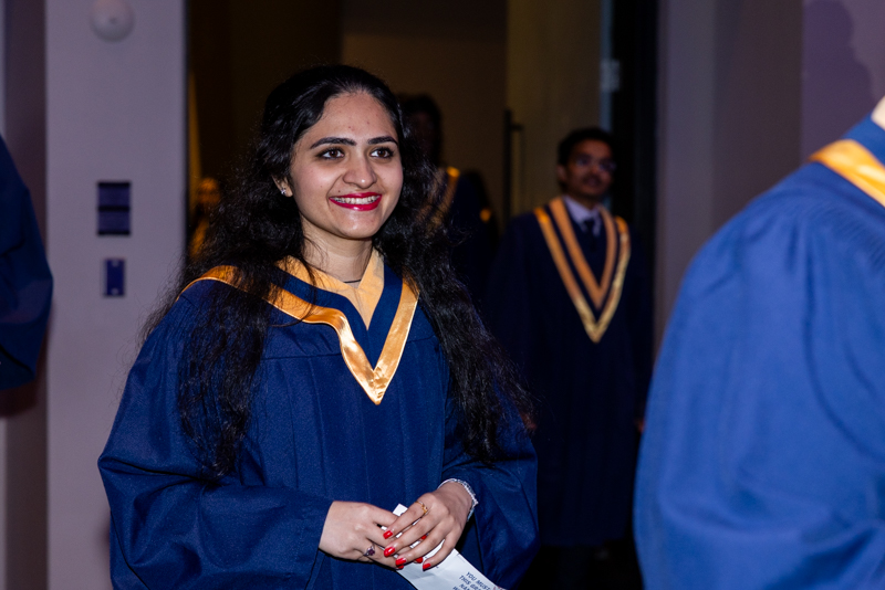 Student smiling in line