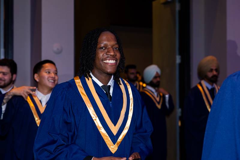 Student smiling in line