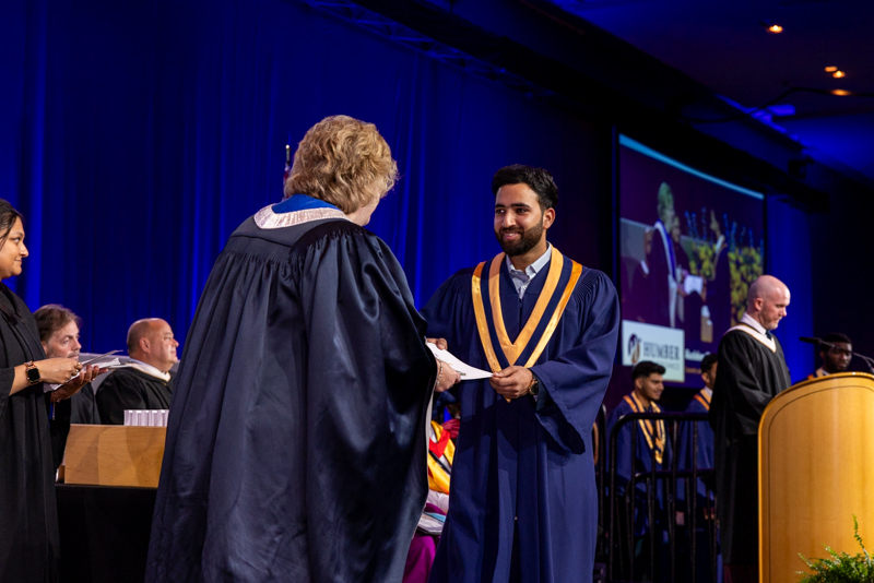 Student receiving diploma