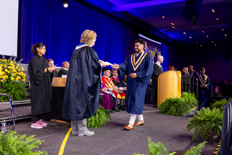 Student receiving diploma