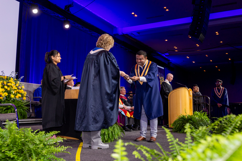 Student receiving diploma