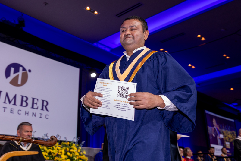 Student holding diploma