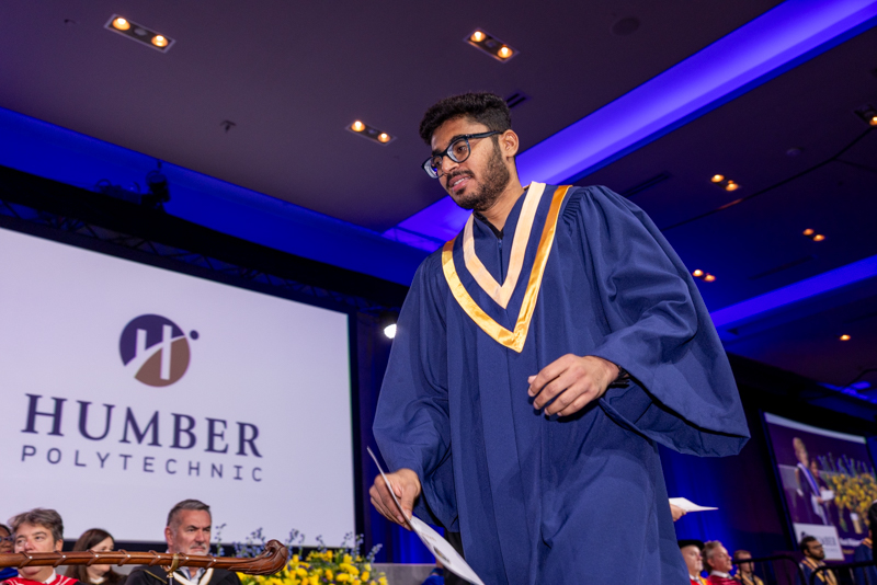Student holding diploma