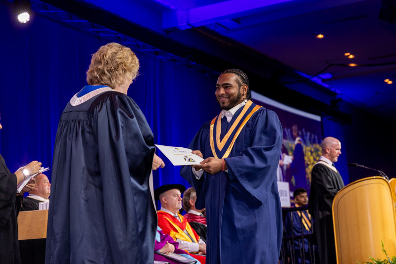 Student receiving diploma