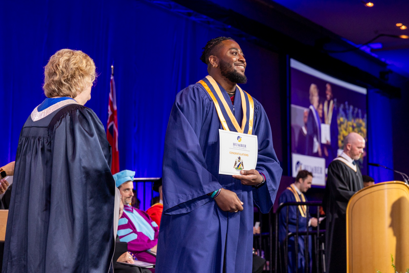 Student holding diploma