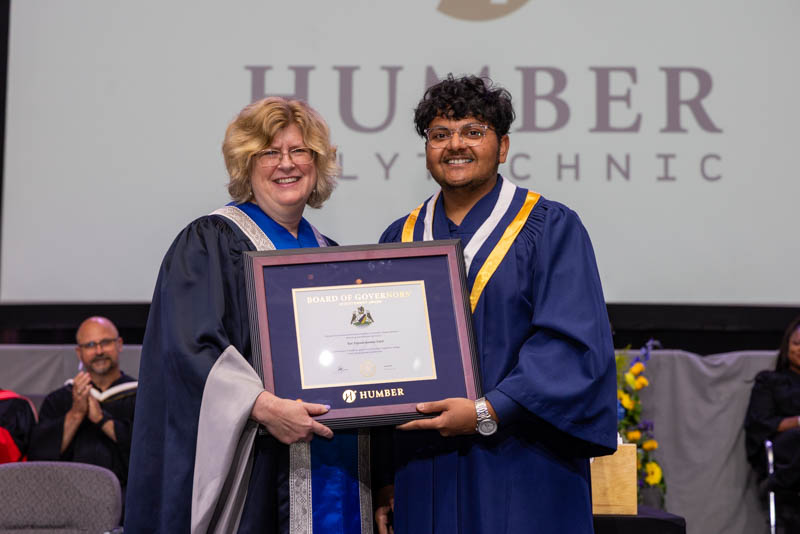 student receiving certificate