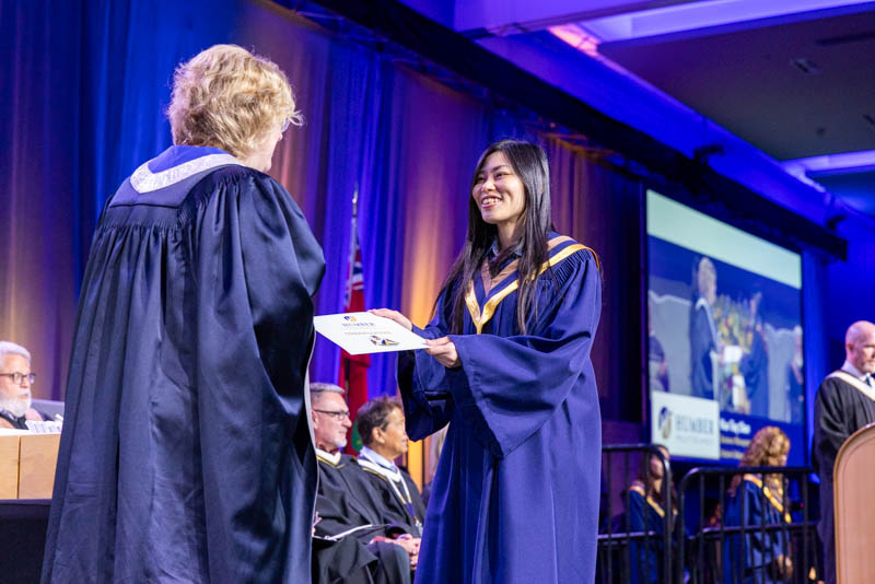 grad receiving their certificate