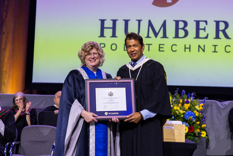 grad receiving their certificate