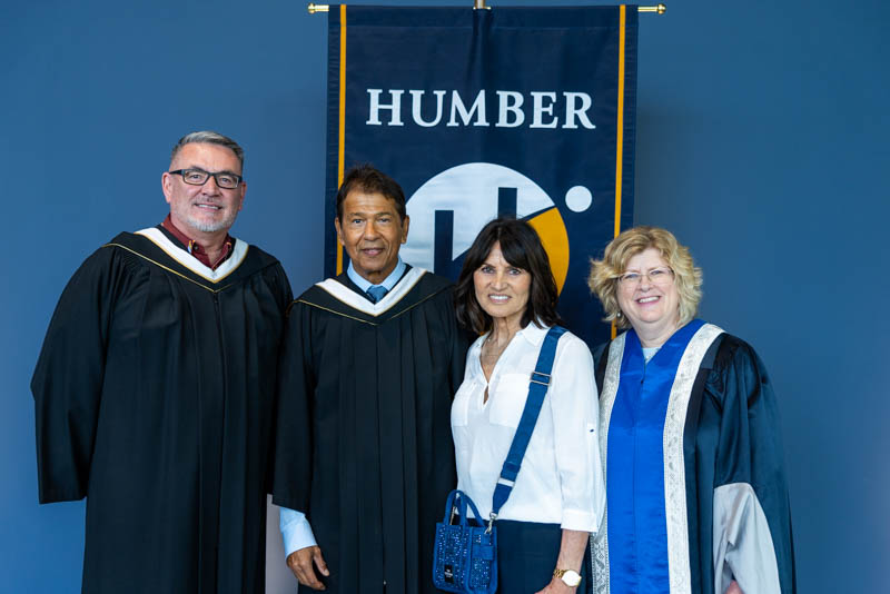 grad and other people smiling