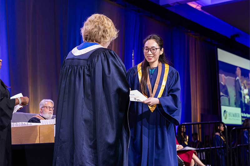 Student receiving diploma