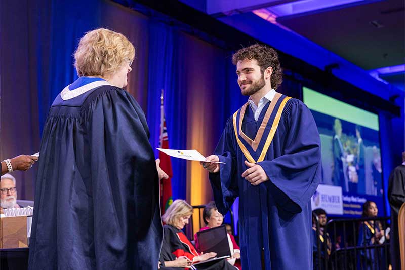 Student receiving diploma