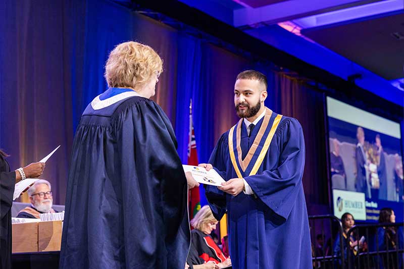 Student receiving diploma