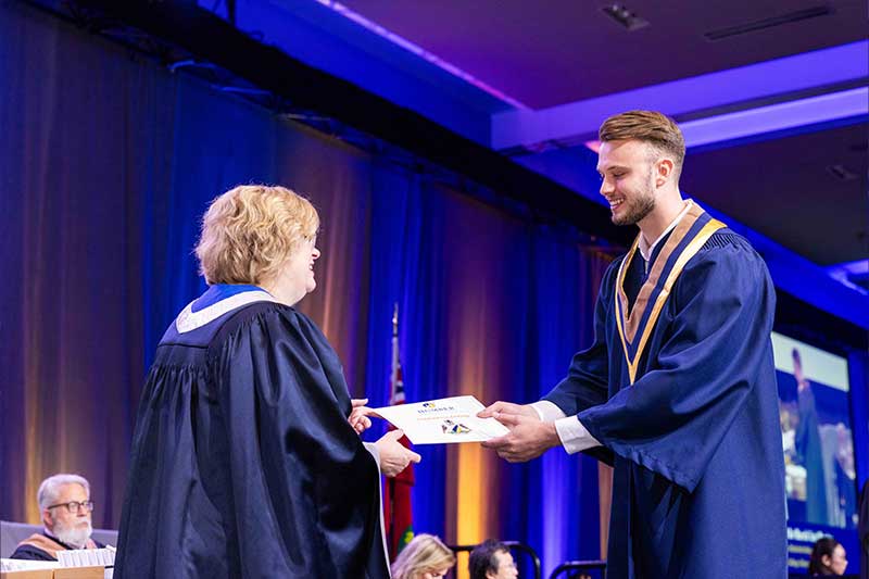Student receiving diploma