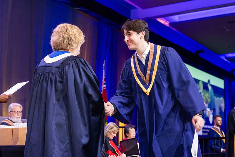 Student receiving diploma