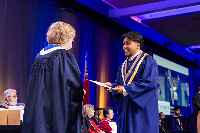 Student receiving diploma