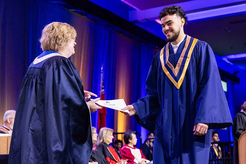 Student receiving diploma