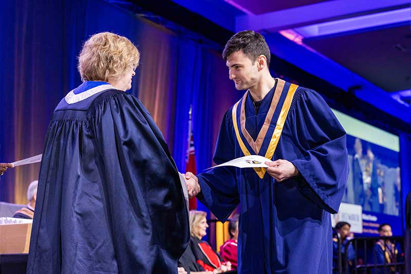 Student receiving diploma