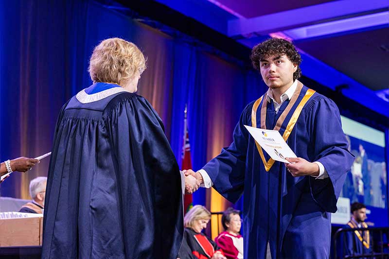 Student receiving diploma