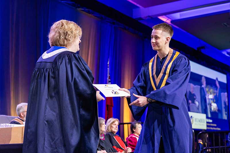 Student receiving diploma