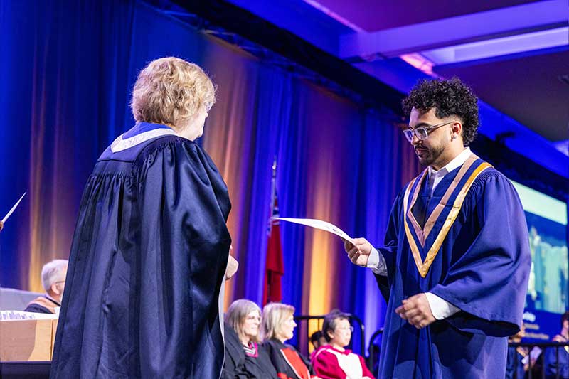 Student receiving diploma
