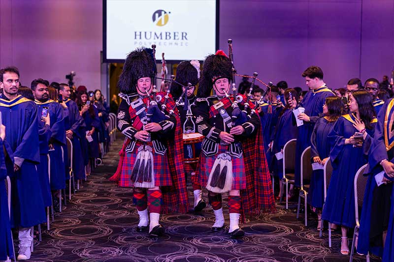 People playing the bagpipes