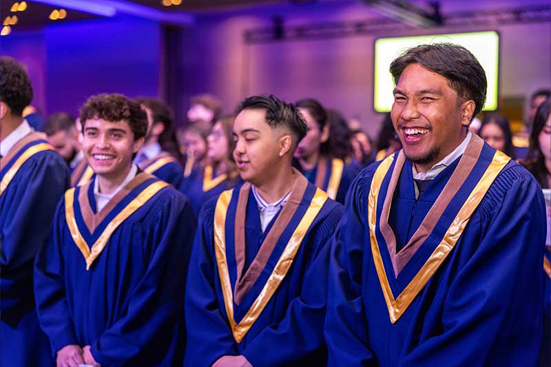 Students smiling at the ceremony