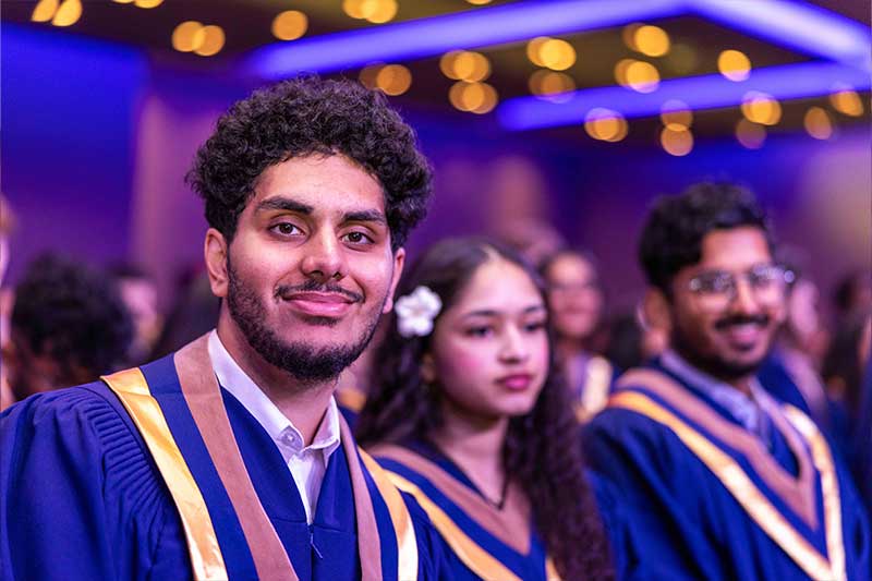 Students smiling at the ceremony